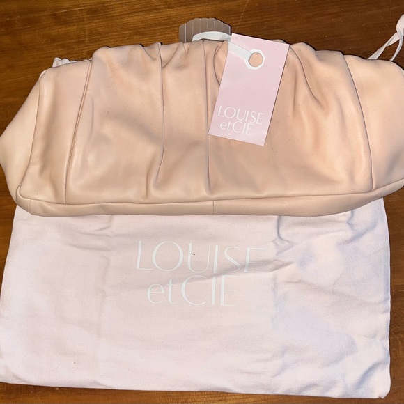 Louise et Cie Handbags - Louise et Cie Soft Pink Clutch with dust bag and original tag